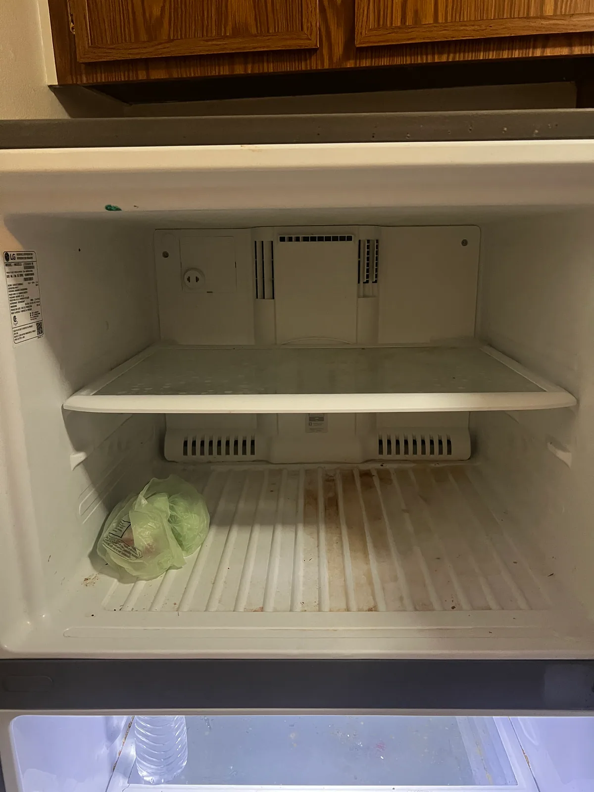 Freezer interior before a StudioScrubz deep cleaning