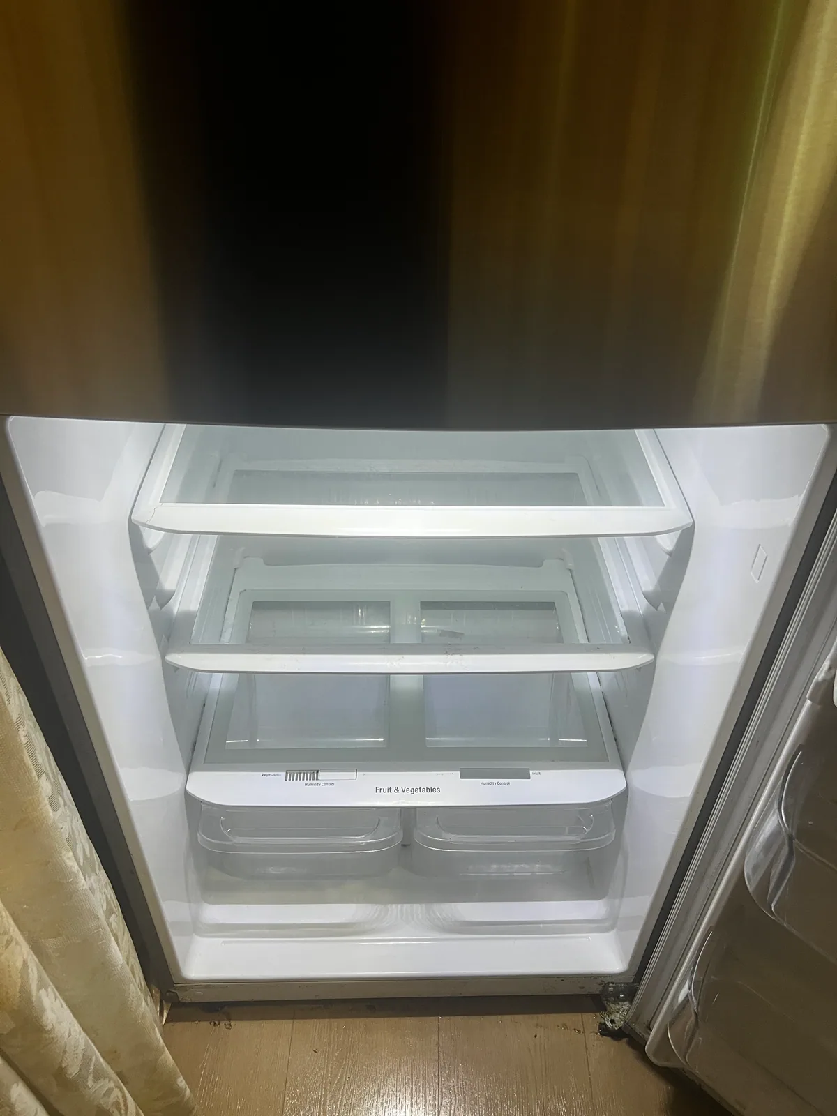 Clean refrigerator shelves and drawers after a StudioScrubz deep cleaning