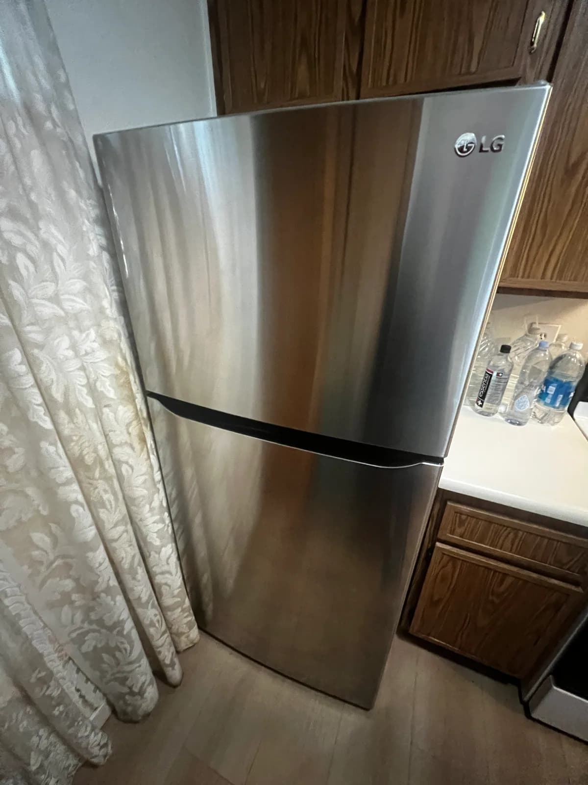 Polished stainless-steel refrigerator exterior after StudioScrubz cleaning